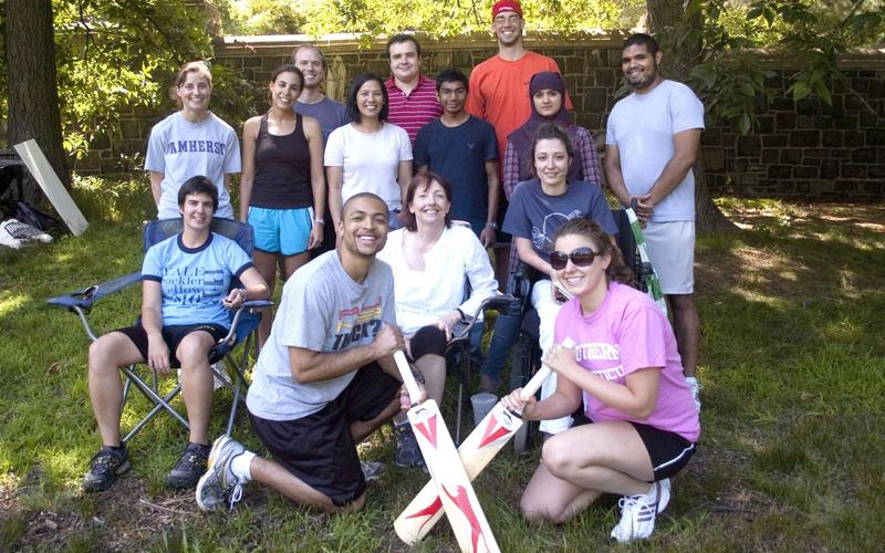 Students and program leadership group in athletic attire