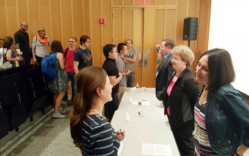 REU students talking with a panel speaker 