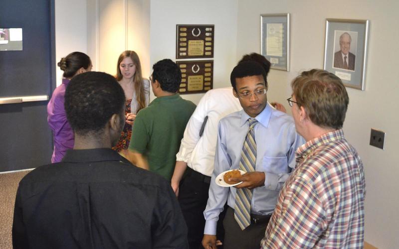 Group of people talking to one another