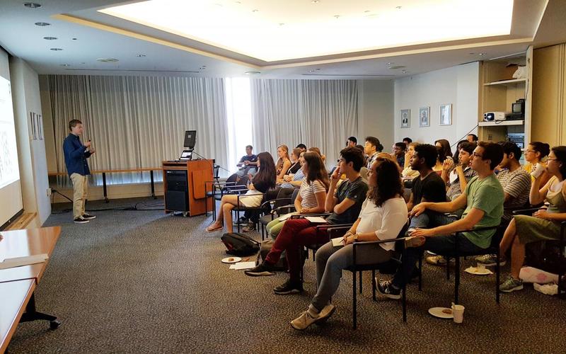 REU student giving an oral presentation in front of an audience