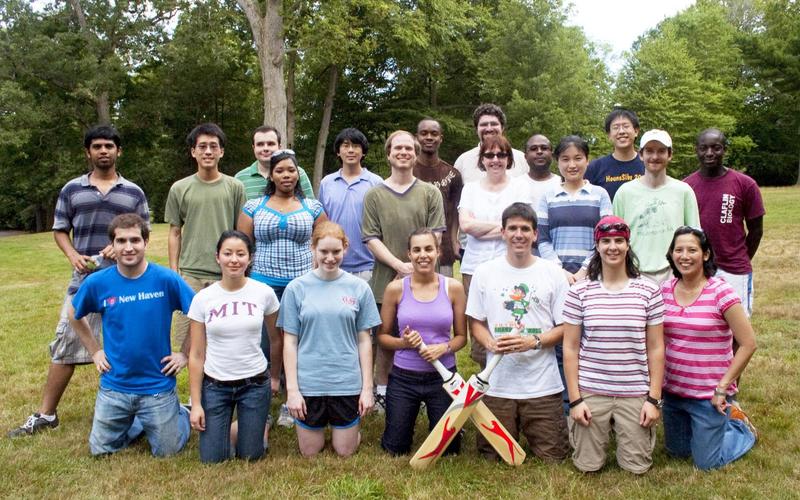 Students and program leadership group in athletic attire