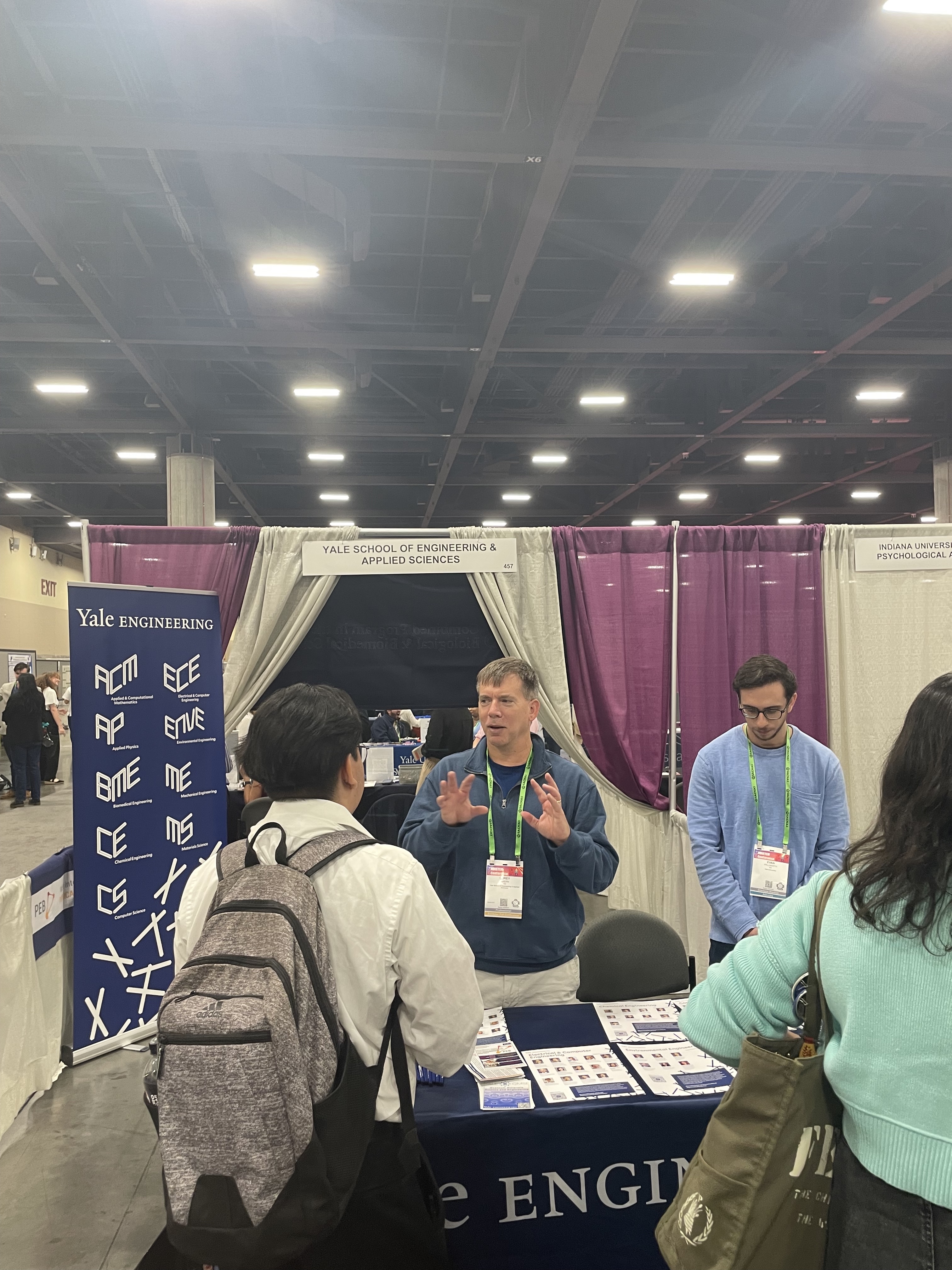 Corey speaking to students at the SEAS recruitment booth