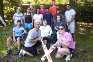 Students and program leadership group in athletic attire