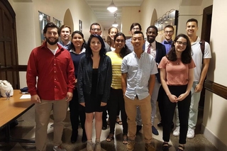 Group of REU students in professional attire