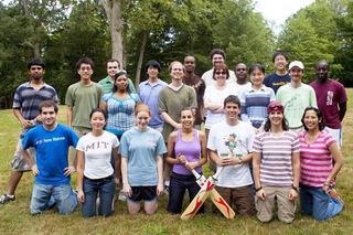 Students and program leadership group in athletic attire