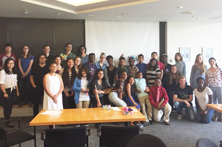 Group of REU students and participants at an outreach event