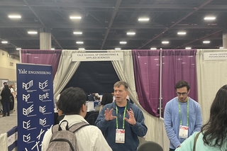 Corey speaking to students at the SEAS recruitment booth