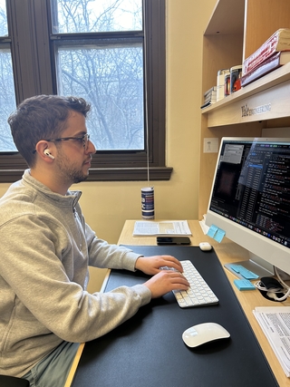 Arlind working at his computer