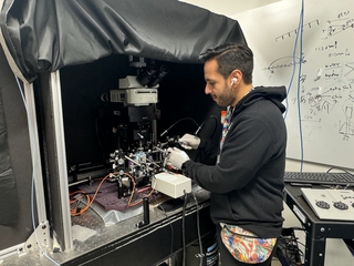 Gustavo working at the microscope