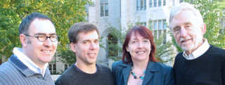 Four founding members of PEB standing in a group