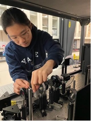 SeungYun working on a microscope